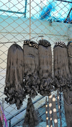 Bangalore,Karnataka,India-January 01 2023: Womens black hair wig on sale in Shivaji nagar photo