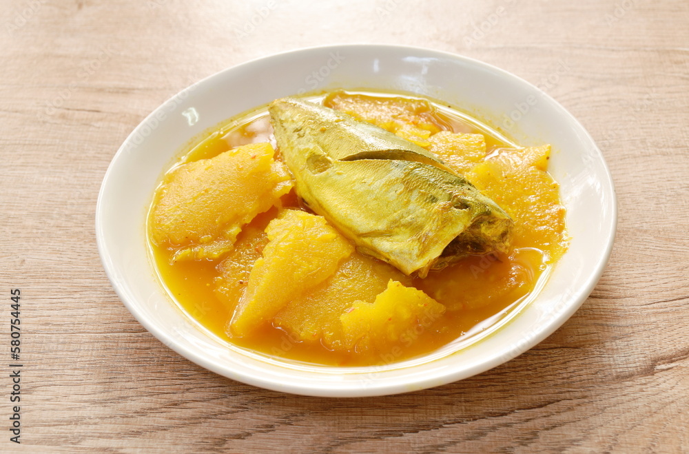 boiled mackerel with slice pineapple in spicy and sour soup on plate boiled mackerel with slice pineapple in spicy and sour soup on plate