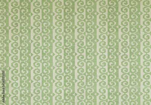 Old wallpaper on the wall. Old wallpaper for texture or background.