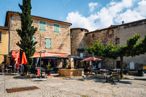 Terrace of a restaurant in summer on the main square of Boulieu Les Annonay in the south of France (Ardeche) © Pernelle Voyage