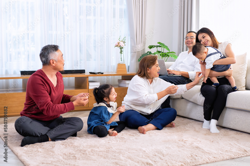 The family have fun relax engaged in fitness yoga at home using online instruction from laptop The family have fun relax engaged in fitness yoga at home using online instruction from laptop