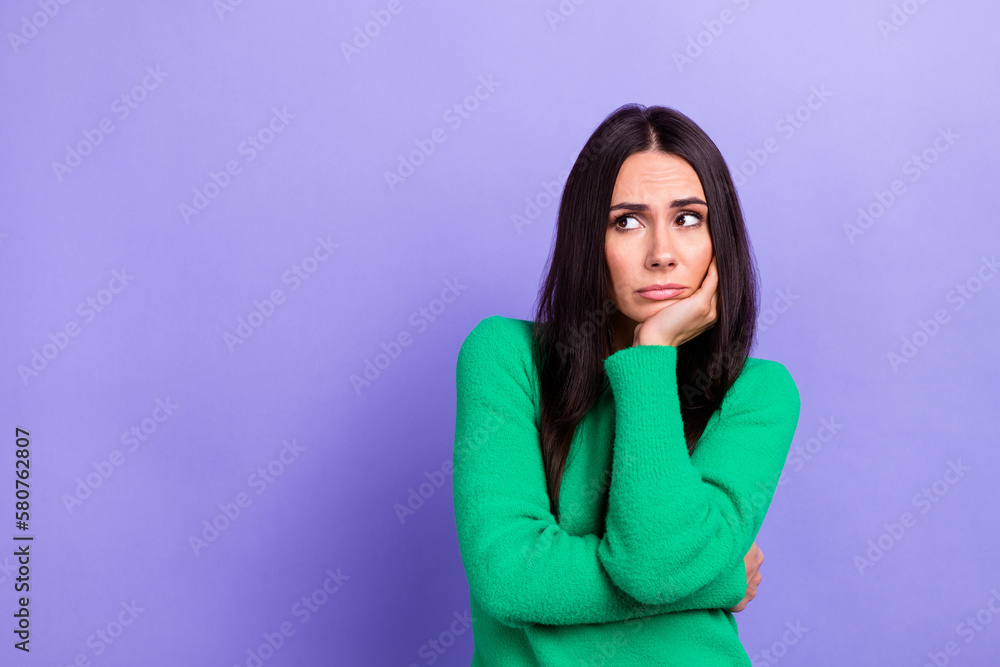 Photo of upset bored woman wear green pullover arm chin looking emtpy space isolated purple color background - obrazy, fototapety, plakaty 