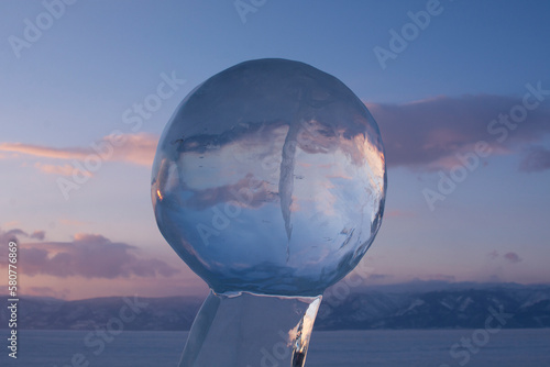 Fototapeta Naklejka Na Ścianę i Meble -  ice ball on the background of sunset on the island of Olkhon, Baikal