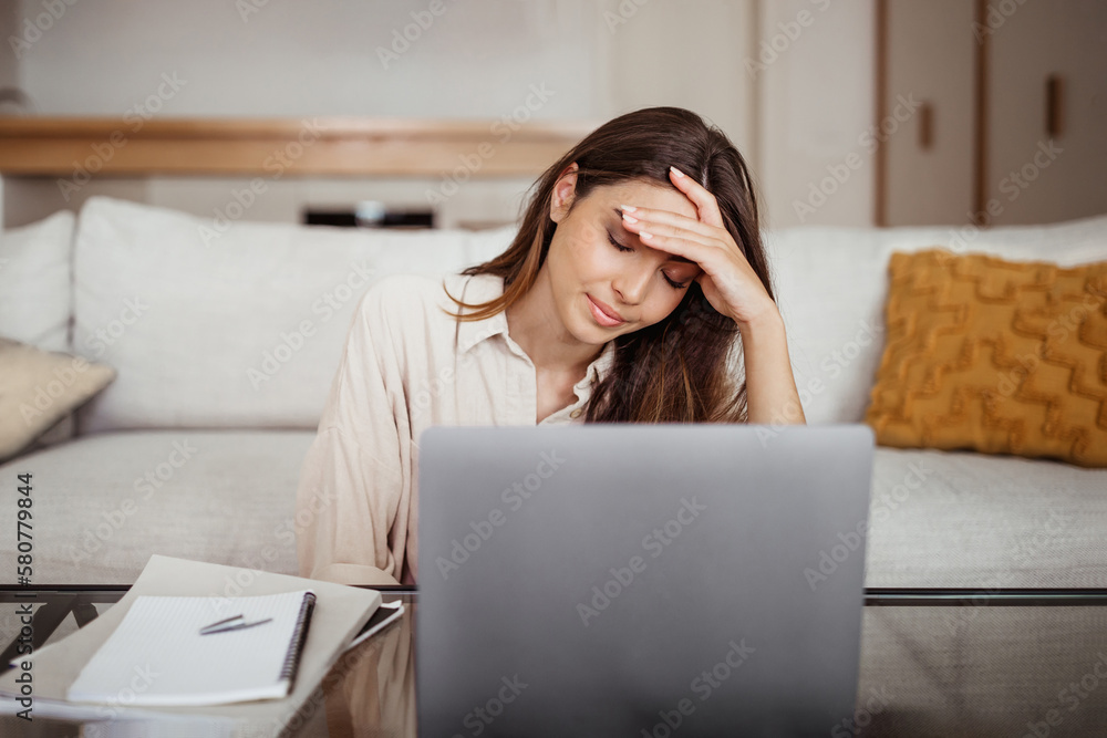 Sad tired young asian lady thinking, sleep at laptop, suffering from overwork, stress Sad tired young asian lady thinking, sleep at laptop, suffering from overwork, stress