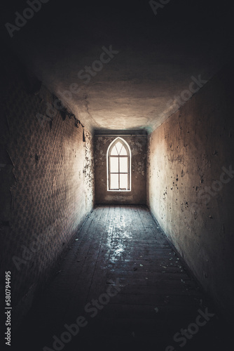 Light at the end of a dark abandoned corridor