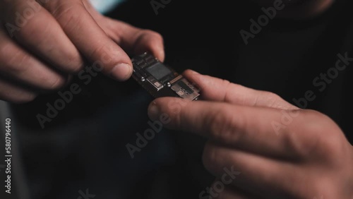 Man engineers fixing smartphone broken screen lots of close-ups b-roll. Fixing process in repair shop - repairman working with broken mobile phone, special tools on workplace.