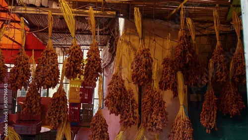 Market counter with various assorted dried plants in Tunnis. African Local market place intended for tourists. photo