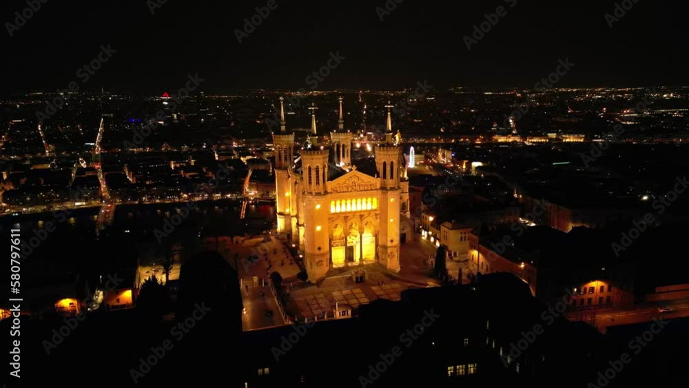 Panoramic aerial shot at night time of illuminated Basilica Notre Dame de Fourviere - Lyon Panoramic aerial shot at night time of illuminated Basilica Notre Dame de Fourviere - Lyon