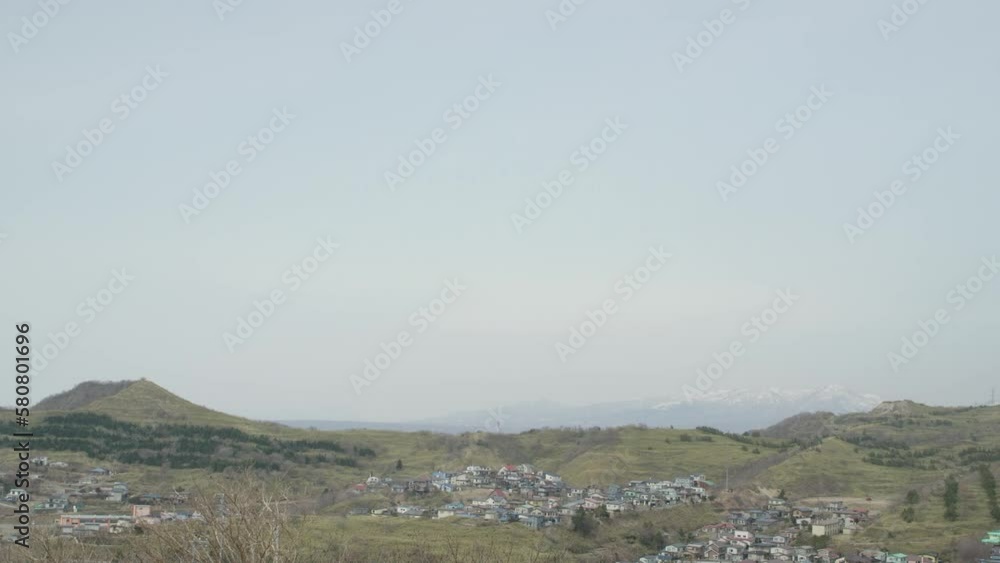 Hills on the coast of Muroran, sea, Hokkaido, background, time-lapse video, clouds, fields in Japan Hills on the coast of Muroran, sea, Hokkaido, background, time-lapse video, clouds, fields in Japan