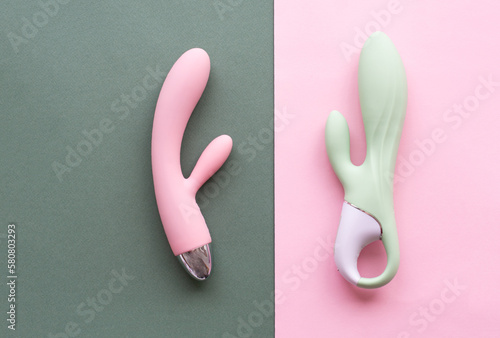 A set of toys for adults on a green and pink background