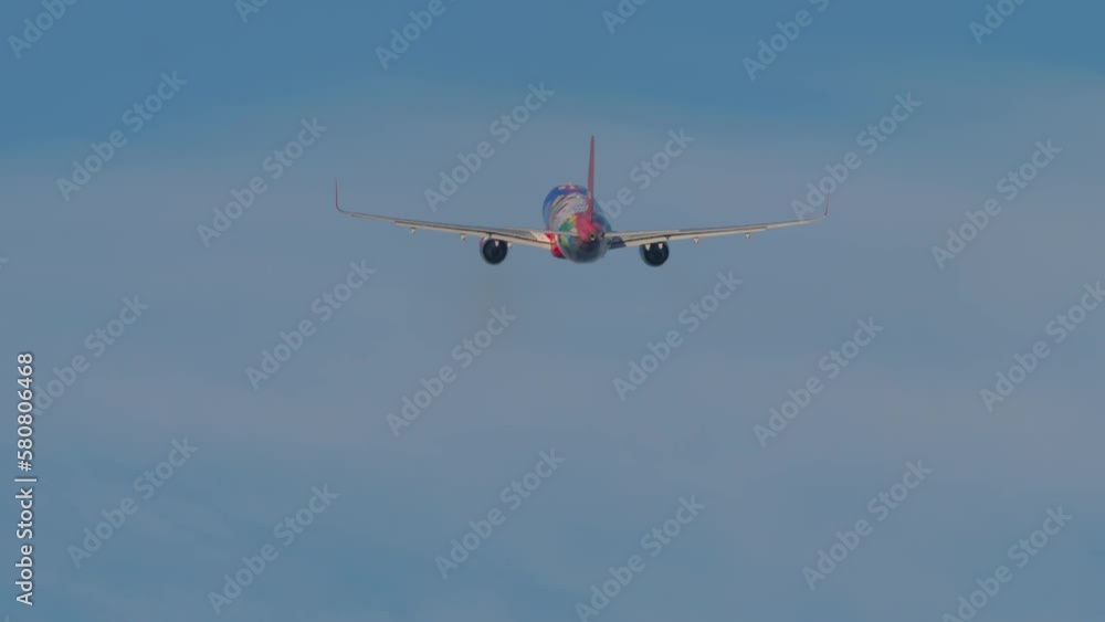 Passenger plane take off, rear view. Jet aircraft departure, climb. Airplane in the blue sky. Tourism and travel concept Passenger plane take off, rear view. Jet aircraft departure, climb. Airplane in the blue sky. Tourism and travel concept
