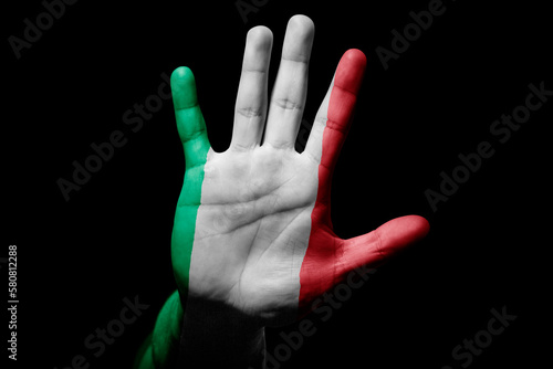 man hand with flag of Italy in stop sign