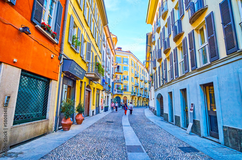 Stroll along Via Madonnina in busy Brera district of central Milan, Italy