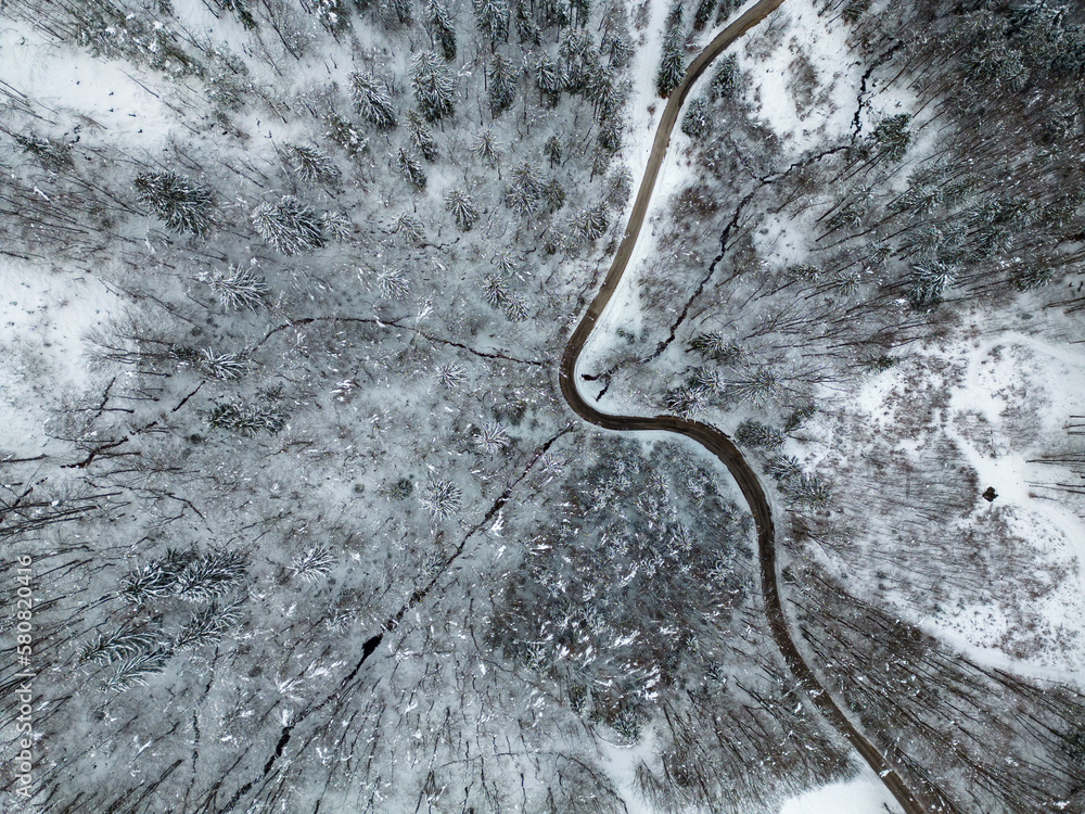 Overhead view with a drone of a beautiful snow covered winter nature
