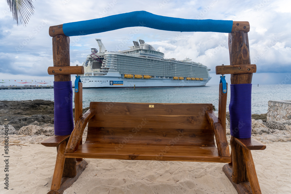 Coco Cay, Bahamas Symphony of the Seas cruise ship and wood swing on the beach at Cococay