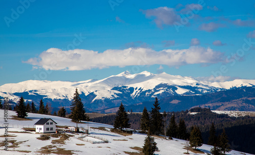 Landscape with the peaks of Ineu, Ineut and Rosu from the Rodna mountains covered by snow