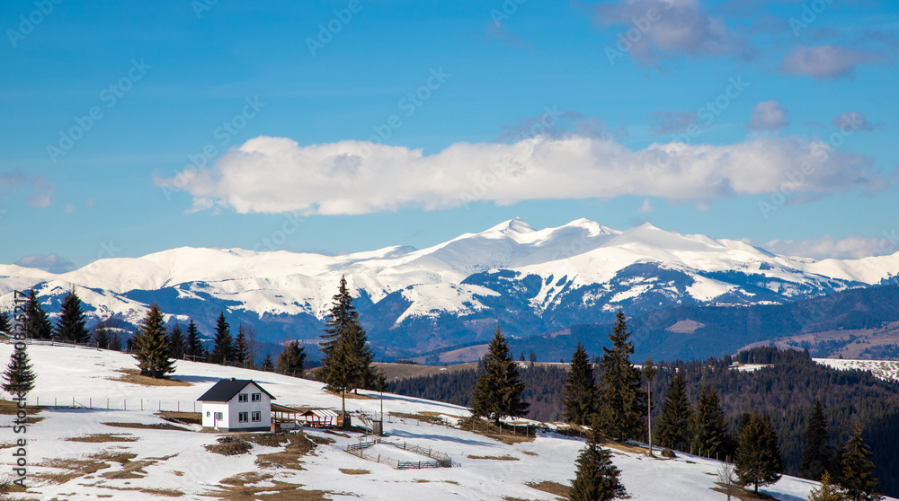 Landscape of a house in a mountain area in winter