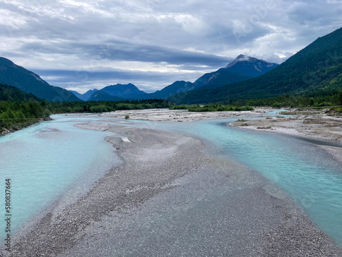 Blue water and stone banks of the lech river in austira photo