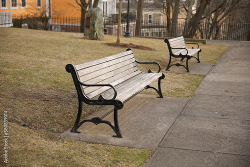 public bench in nature and city showing a colorful peace made of wood symbolizing morning environment