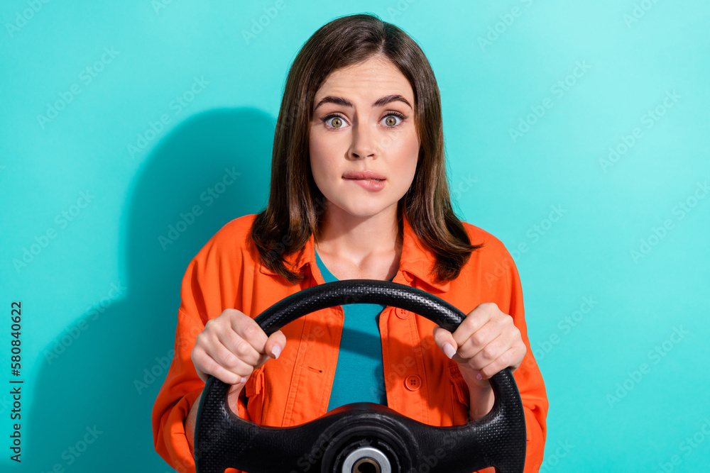 Photo of stressed depressed lady wear trendy orange clothes first trip unknown road try avoid accident isolated on cyan color background Photo of stressed depressed lady wear trendy orange clothes first trip unknown road try avoid accident isolated on cyan color background