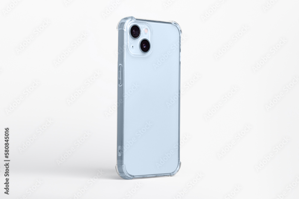 Phone case mock up side view. blue iPhone 14 plus in clear transparent soft silicone case isolated on gray background, rotated position. Smartphone perspective view Phone case mock up side view. blue iPhone 14 plus in clear transparent soft silicone case isolated on gray background, rotated position. Smartphone perspective view