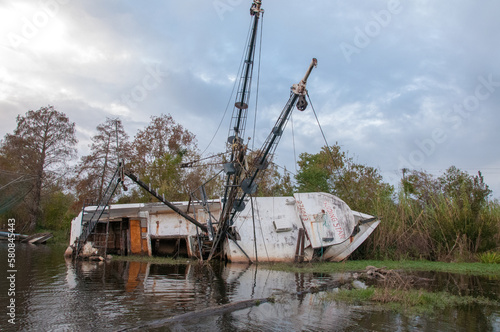 NEW ORLEANS, LOUISIANA - NOVEMBER 26, 2011:  Upside down and flooded during Hurricane Sandy yacht  in New Orleans, Louisiana