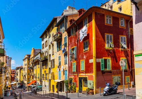 Colorful tenement houses along Rue Rossetti street in Vieille Ville historic old town district of Nice on French Riviera in France photo