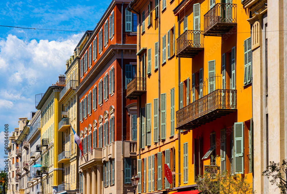Colorful tenement houses along Rue Saint Francois de Paule street in historic Vieux Vieille Ville old town of Nice on French Riviera Azure Coast in France