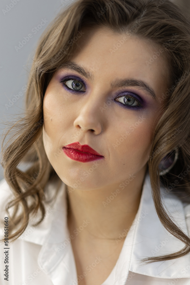 Portrait of attractive beautiful fashionable young woman dressed in the style of 1980s, with bright fancy make up. 80s inspiration and vibes Portrait of attractive beautiful fashionable young woman dressed in the style of 1980s, with bright fancy make up. 80s inspiration and vibes