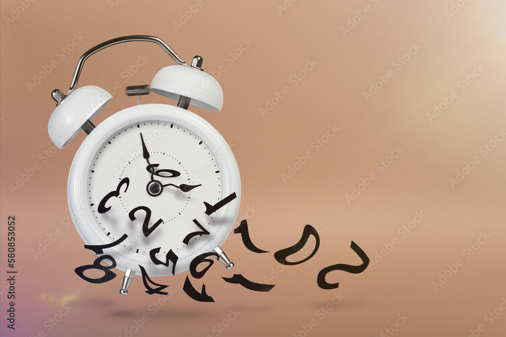 Time is running out. White alarm clock with flying numbers as a symbol