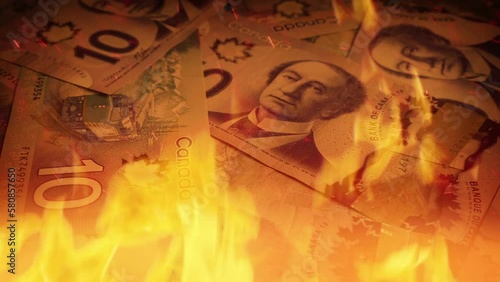 Canadian Banknotes In Fire Economy Concept photo