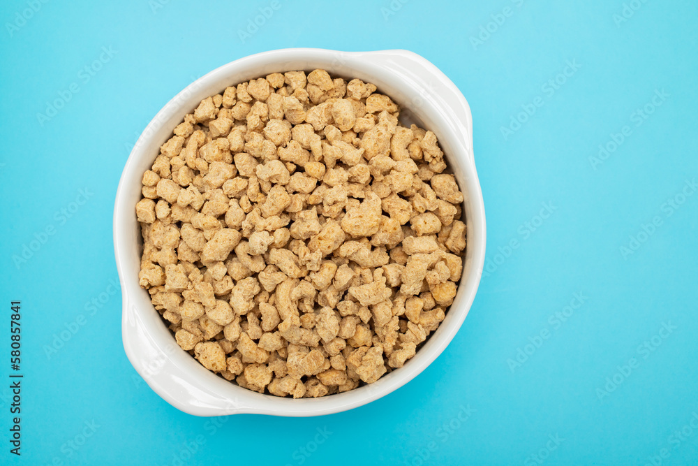 dry uncooked soya in white small bowl dry uncooked soya in white small bowl