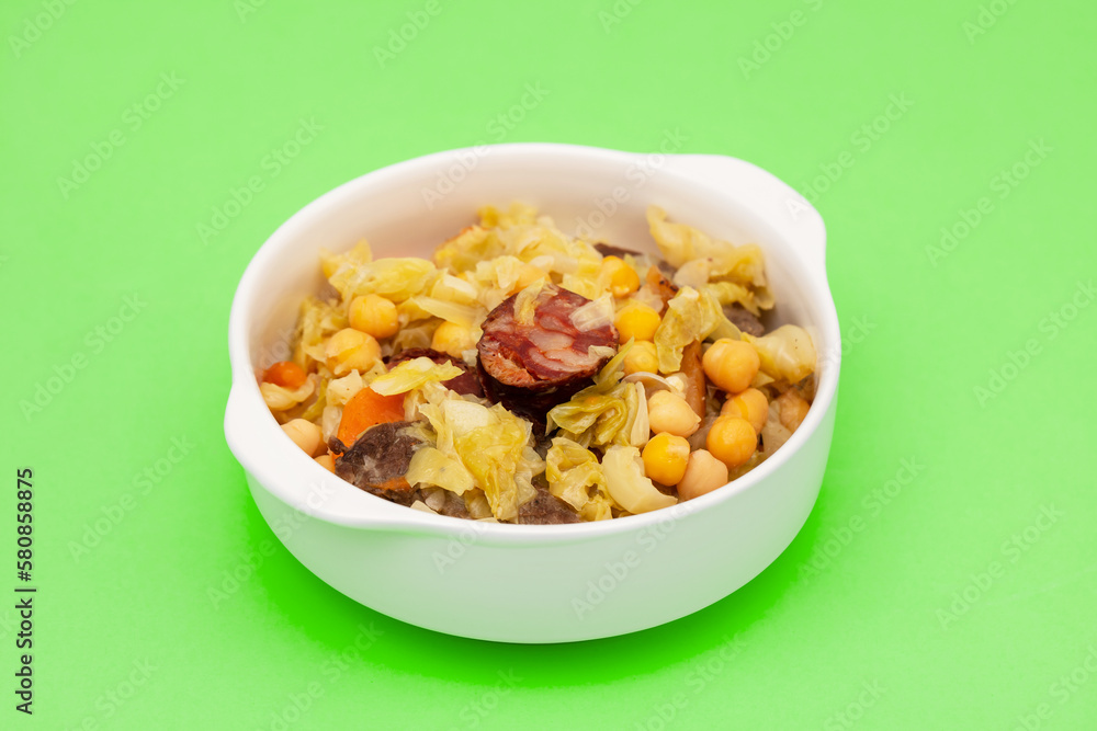 Traditional chickpeas dish in casserole in white bowl Traditional chickpeas dish in casserole in white bowl