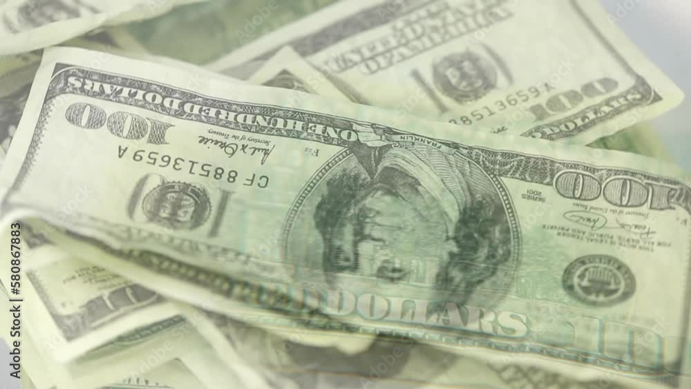 Animation of american dollar banknotes spinning on white background Animation of american dollar banknotes spinning on white background