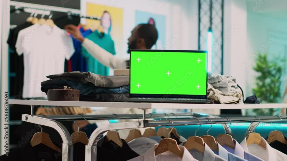 Modern pc with greenscreen template in clothing shop, running blank ...