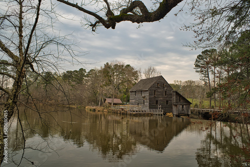 Fototapeta A Spring landscape of the historic Yates Mill Park Pond and gristmill in Raleigh, NC