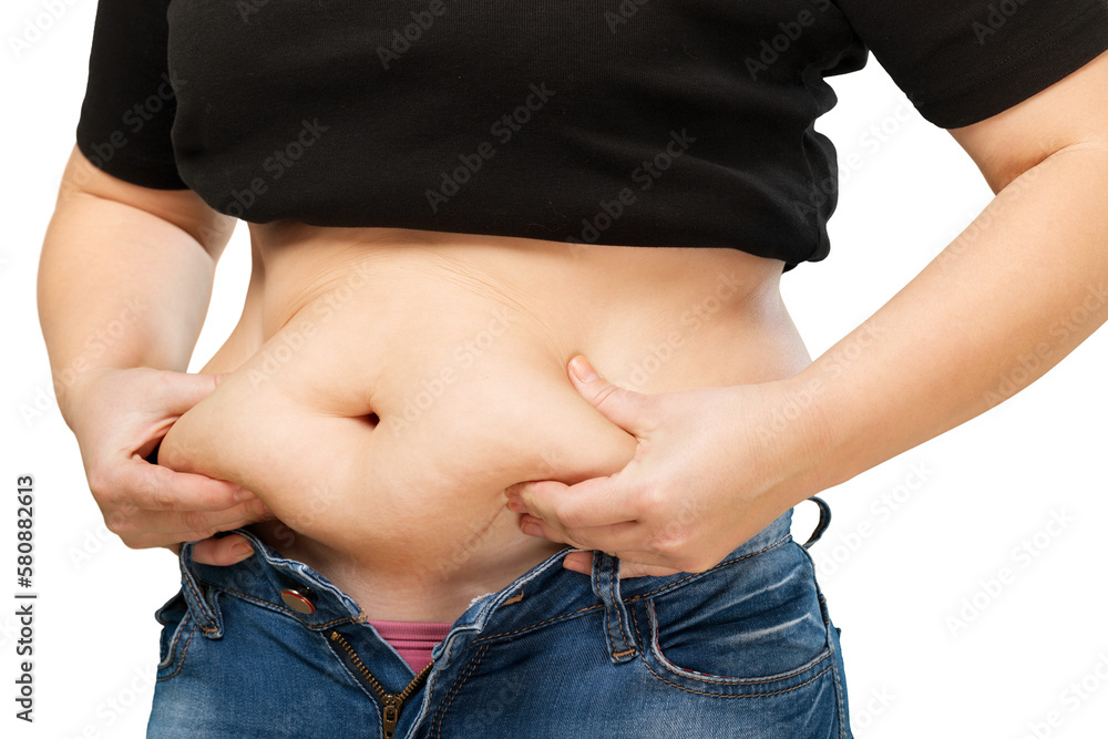 Naklejka premium Woman's hand holding excessive belly fat
