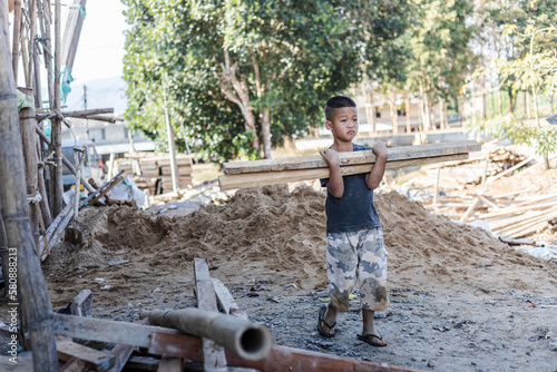 Children working at construction site for world day against child labor concept: © AungMyo