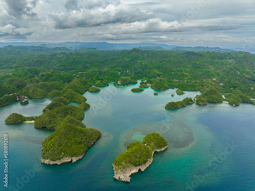 Tropical islands in a beautiful bay with turquoise water and lagoon view from above. Sipalay, Negros, Philippines.