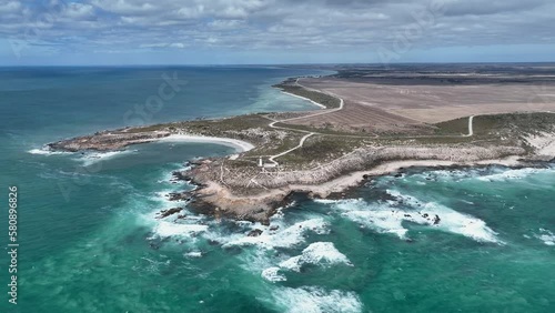 Drone shot orbiting Corny Point lighthouse near the rocky shores of Corny Point and Horse Shoe Bay. Yorke Peninsula, South Australia