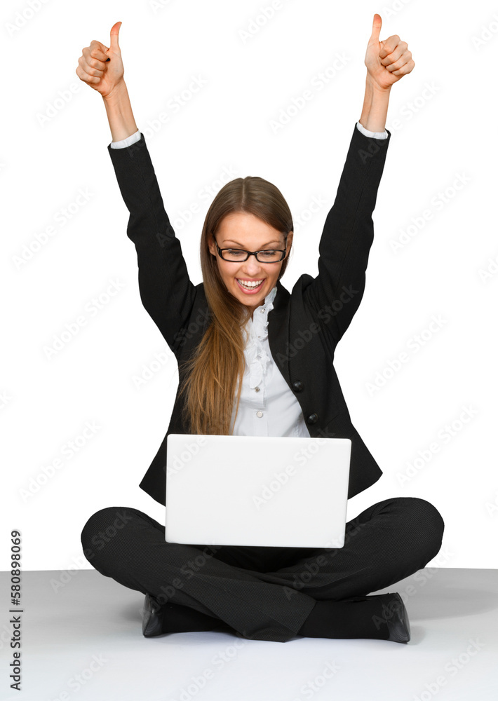 Excited Businesswoman Sitting Cross Legged on Ground with Laptop - Isolated Excited Businesswoman Sitting Cross Legged on Ground with Laptop - Isolated
