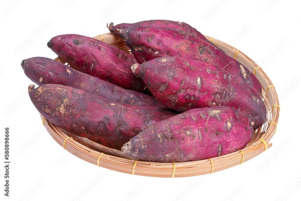 Collection of whole raw Japanese sweet potatoes on wicker basket. Collection of whole raw Japanese sweet potatoes on wicker basket.