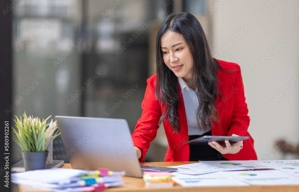 Businesswoman working at office with documents on desk, doing planning analyzing the financial report, Asian woman business plan investment, finance analysis concept Businesswoman working at office with documents on desk, doing planning analyzing the financial report, Asian woman business plan investment, finance analysis concept