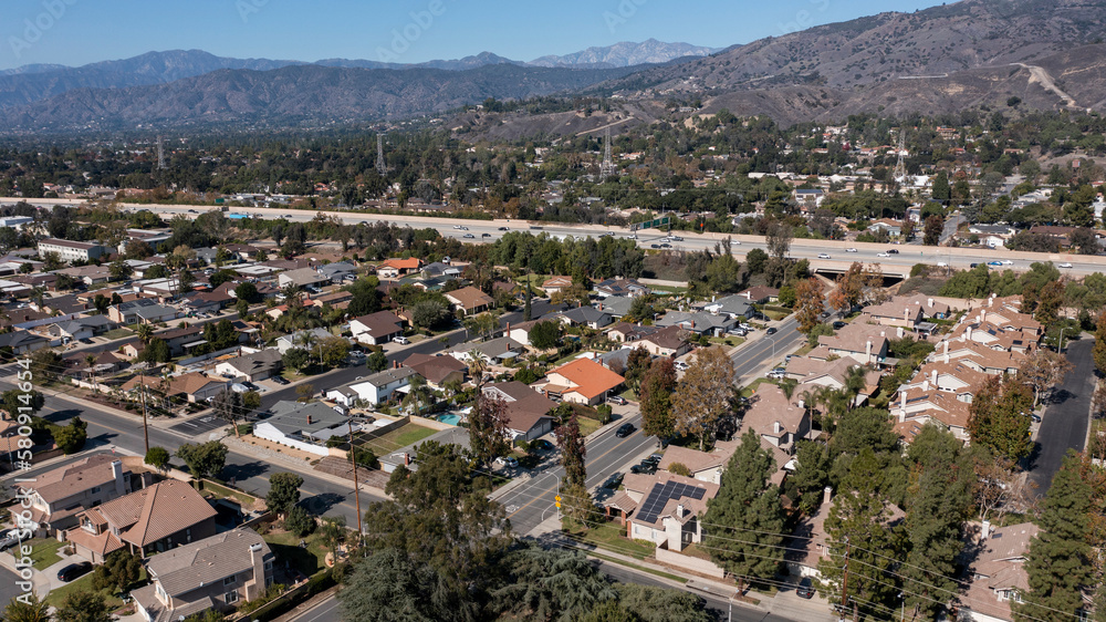 Daytime aerial view of a suburban neighborhood in San Dimas, California, USA.