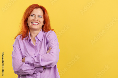 Happy mature woman laughing and looking at the camera