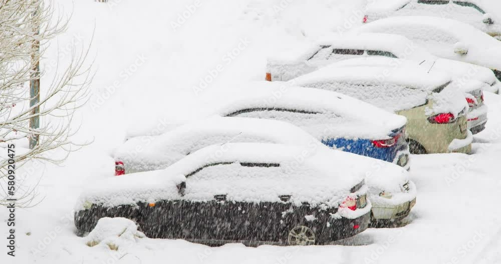 4k video of a snow covered cars during a snowstorm. 4k video of a snow covered cars during a snowstorm.