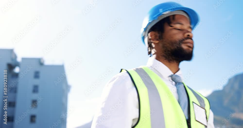 Engineer, construction and building outdoor with a black man with a helmet and goals. Engineering person or male contractor worker in city for development project planning for industry with safety Engineer, construction and building outdoor with a black man with a helmet and goals. Engineering person or male contractor worker in city for development project planning for industry with safety
