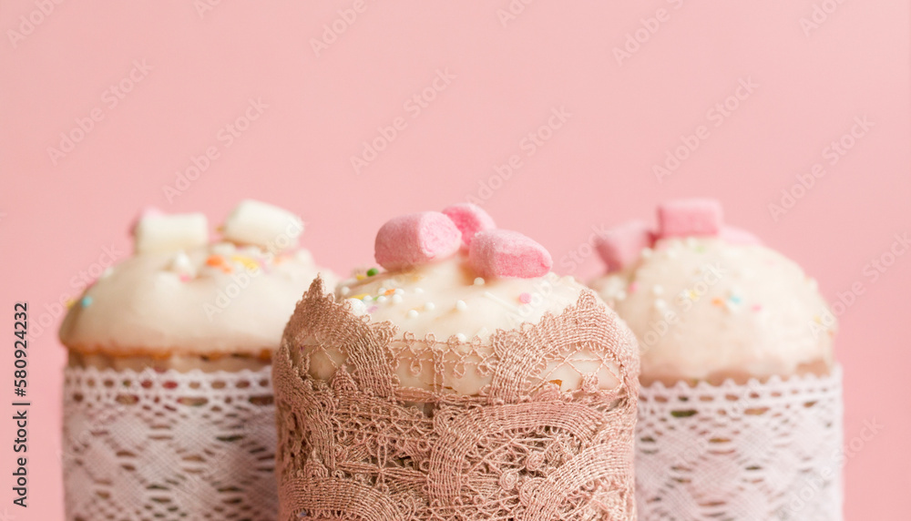 Easter cake on a pink background. Beautiful pastries. Easter card . Close-up. Selective focus. Easter cake on a pink background. Beautiful pastries. Easter card . Close-up. Selective focus.
