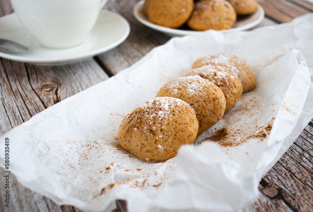 Freshly baked cookies with cinnamon, coffee. Sweet lunch. On a wooden background Freshly baked cookies with cinnamon, coffee. Sweet lunch. On a wooden background