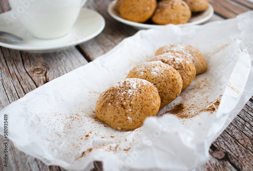 Freshly baked cookies with cinnamon  coffee. Sweet lunch. On a wooden background